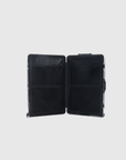 Interior view of The Signature Series L 'Advanced' Black suitcase with spacious compartments and pockets.