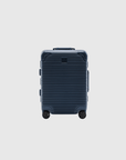 Navy carry-on suitcase with a zipless TSA-approved lock, engineered for strength and travel efficiency.