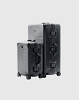 The Signature Series 'Advanced' black luggage set, featuring durable polycarbonate and aluminum design, perfect for travel.