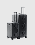 The Signature Series "Advanced" Set in Black, featuring durable polycarbonate and sleek design for modern travel.