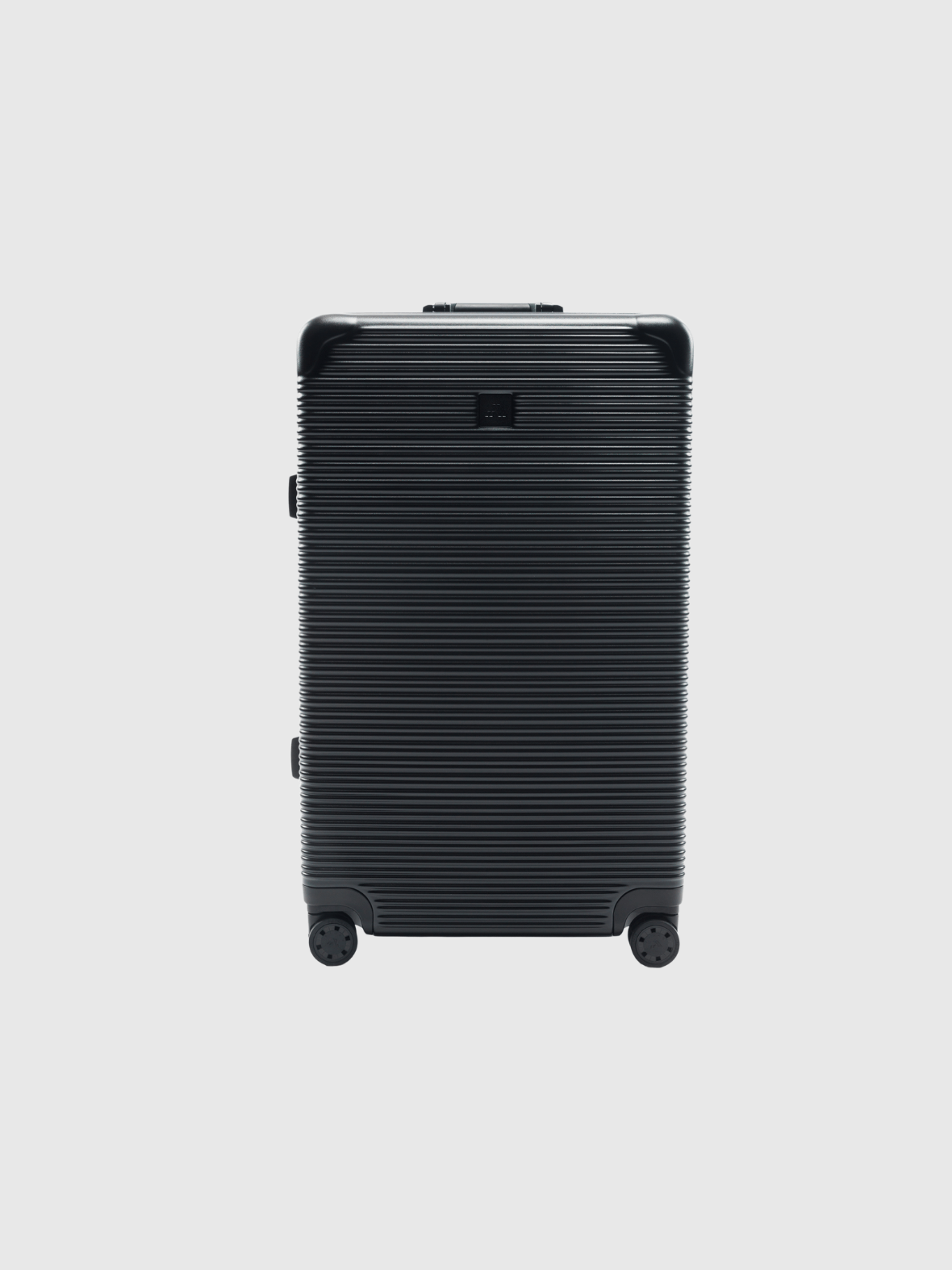 Signature Series L 'Advanced' Black suitcase with sturdy wheels and sleek ribbed design.