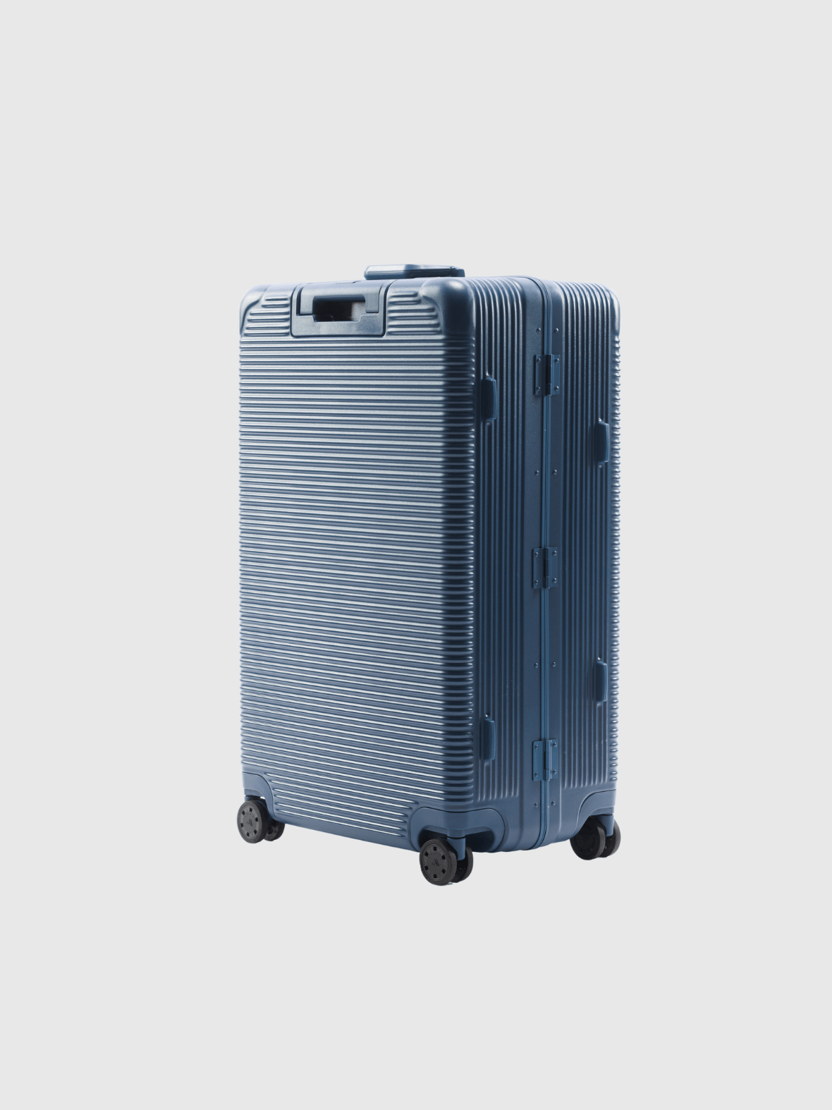 The Signature Series L Advanced Navy suitcase with textured design and wheels, ideal for heavy packers.