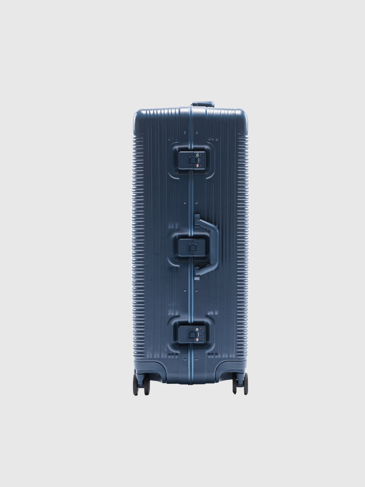 Back view of The Signature Series L 'Advanced' Navy suitcase with a sleek zipless design.