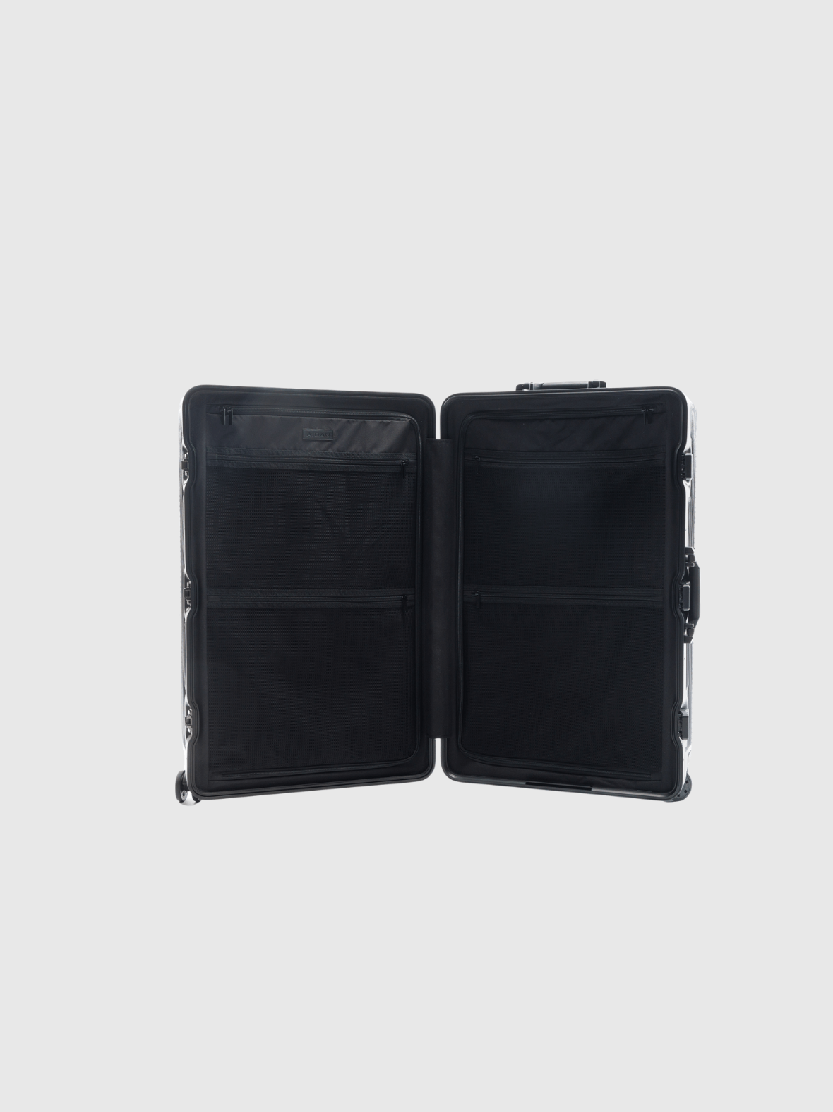 Interior view of The Signature Series L 'Advanced' Black suitcase with spacious compartments and pockets.