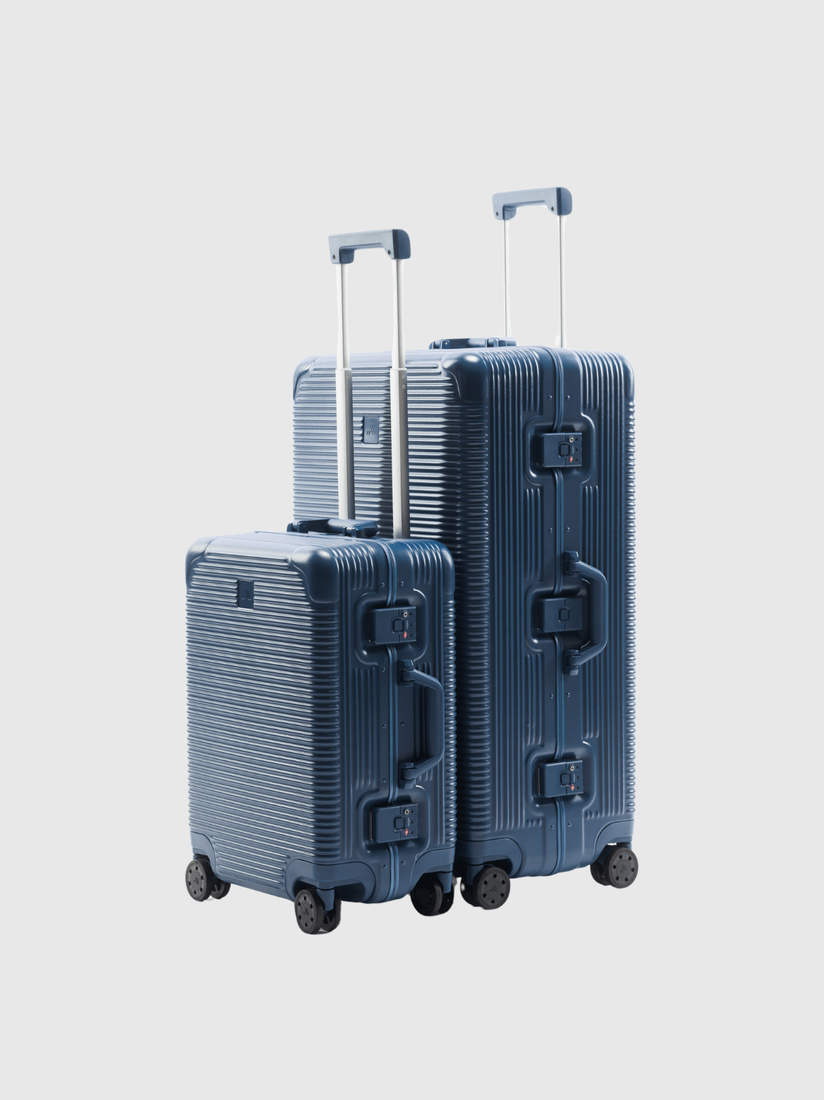 The Signature Series Advanced Set in Navy, featuring two durable polycarbonate suitcases on wheels.