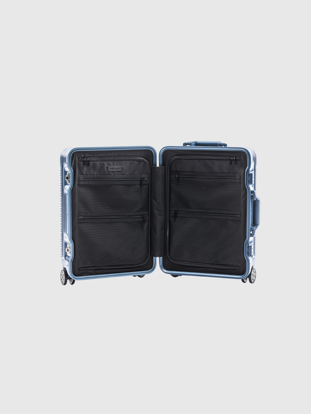 Open interior view of The Signature Series S 'Advanced' Navy carry-on suitcase with black lining and compartments.
