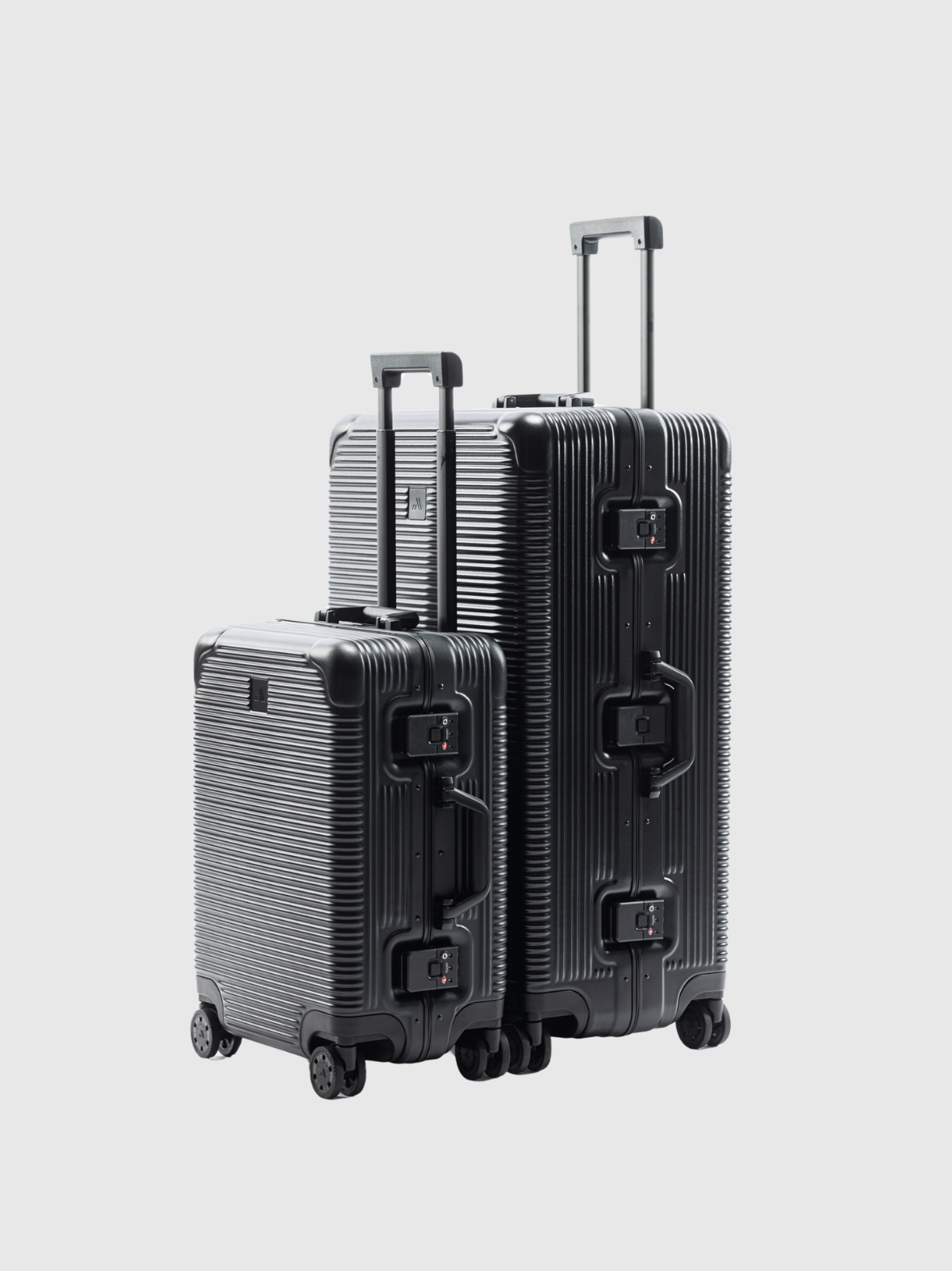 The Signature Series "Advanced" Set in Black, featuring durable polycarbonate and sleek design for modern travel.