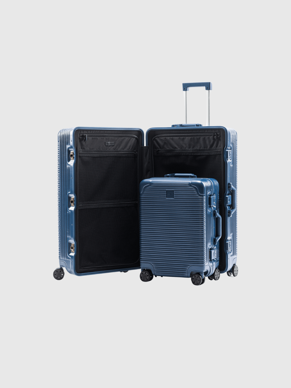 The Signature Series "Advanced" Set in Navy: Two durable polycarbonate suitcases showcasing interior compartments.