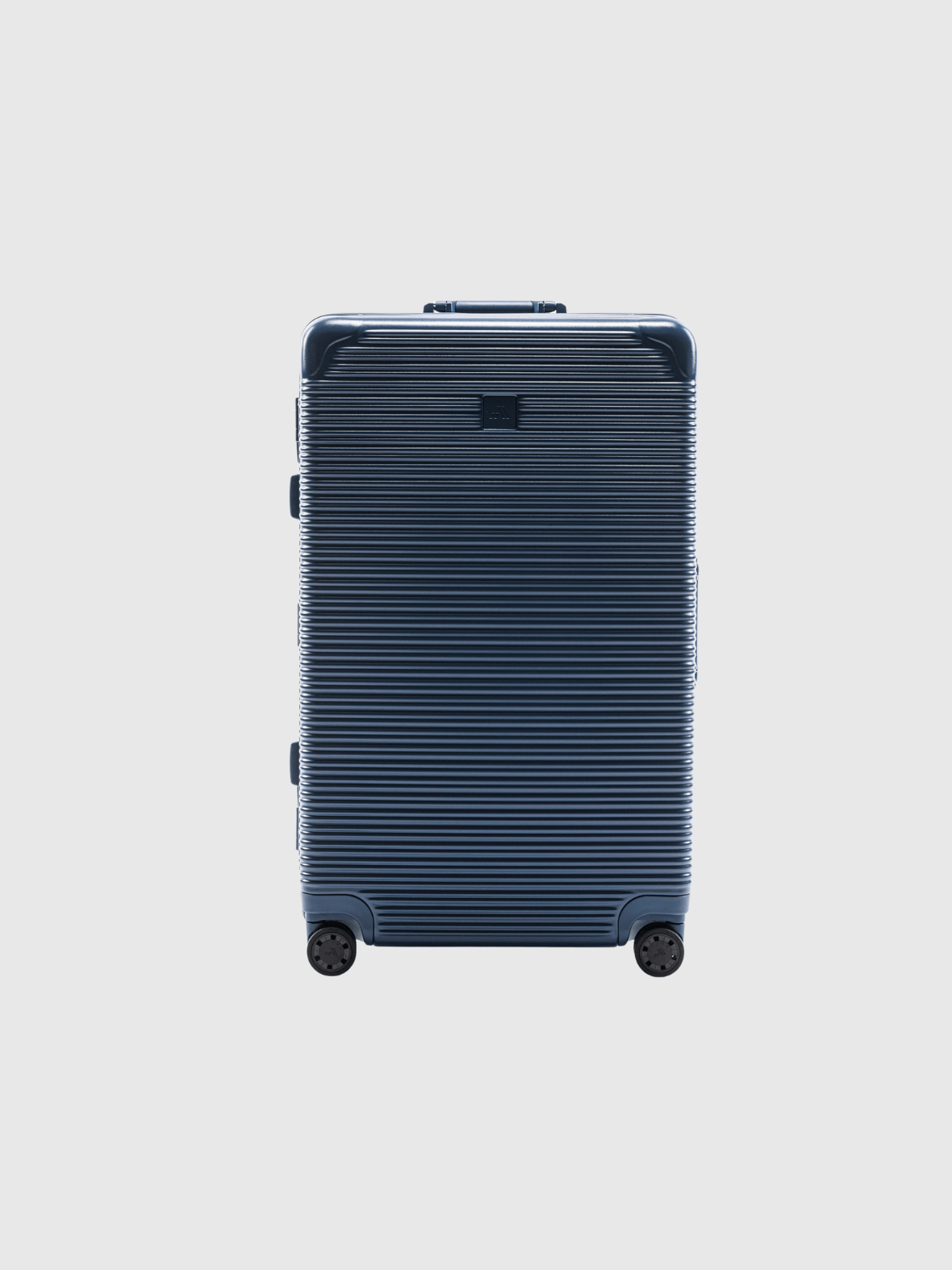 The Signature Series L "Advanced" Navy luggage, featuring a zipless design and 110L capacity, perfect for heavy packers.